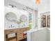 Bright, airy bathroom featuring a double vanity, stylish mirrors, and storage at 5335 W 550 S, Trafalgar, IN 46181
