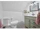 Bathroom with patterned tile floor, olive green vanity and a neutral color scheme at 5335 W 550 S, Trafalgar, IN 46181