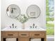 Bathroom featuring double sink vanity with marble countertop and round mirrors at 5335 W 550 S, Trafalgar, IN 46181