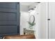 View of modern bathroom with stylish barn door, vanity with plants, and bright lighting at 5335 W 550 S, Trafalgar, IN 46181