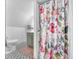 Bathroom showing a floral shower curtain and geometric tile floor at 5335 W 550 S, Trafalgar, IN 46181