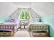 Bedroom featuring matching twin beds and bright natural light at 5335 W 550 S, Trafalgar, IN 46181