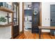 View of bedroom featuring hardwood floors, modern furniture, and gray walls through rustic barn door at 5335 W 550 S, Trafalgar, IN 46181