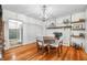 Elegant dining room featuring hardwood floors, brick fireplace, and seamless access to other rooms at 5335 W 550 S, Trafalgar, IN 46181
