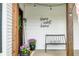 Inviting front porch with decorative flowers, seating, and a 'Home Sweet Home' sign at 5335 W 550 S, Trafalgar, IN 46181