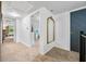 Upstairs hallway with a view to an office space and a blue painted door at 5335 W 550 S, Trafalgar, IN 46181