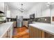 Well-lit kitchen featuring stainless steel appliances, white cabinetry, and stylish countertops at 5335 W 550 S, Trafalgar, IN 46181