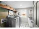 Laundry room featuring modern appliances and stylish finishes, with natural light at 5335 W 550 S, Trafalgar, IN 46181