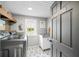 Well-lit laundry room featuring new appliances and stylish finishes at 5335 W 550 S, Trafalgar, IN 46181