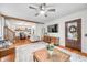 Cozy living room featuring hardwood floors, stylish decor, and seamless access to other rooms at 5335 W 550 S, Trafalgar, IN 46181