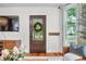 Living room with hardwood floors, TV, decor, and a window view to outdoors at 5335 W 550 S, Trafalgar, IN 46181
