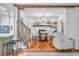 Bright and airy living room with wood beam features, dining area, and open access to kitchen at 5335 W 550 S, Trafalgar, IN 46181