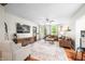 Spacious living room featuring hardwood floors, stylish decor, and abundant natural light at 5335 W 550 S, Trafalgar, IN 46181