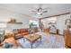 Open-concept living area with hardwood floors, stylish furniture, and an inviting atmosphere at 5335 W 550 S, Trafalgar, IN 46181
