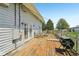 Spacious wooden deck area with dining furniture, complemented by the surrounding yard at 5758 N 1200 E, Sheridan, IN 46069