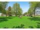 Spacious backyard with a canopy of mature trees offers a serene, private outdoor experience at 5758 N 1200 E, Sheridan, IN 46069