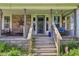 Cozy front porch with brick accents, a seating area, and decorative elements at 5758 N 1200 E, Sheridan, IN 46069