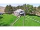 Charming home features a wraparound deck and mature trees, providing an idyllic outdoor experience at 5758 N 1200 E, Sheridan, IN 46069