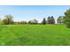 Picturesque acreage with lush lawn, mature trees, and charming outbuildings offers a serene countryside retreat at 5758 N 1200 E, Sheridan, IN 46069