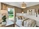 This bedroom is serene with natural light, neutral colors, and a faux horse artwork at 5931 Sterling Dr, Whitestown, IN 46075