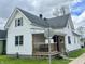 Charming two-story home with a welcoming front porch and manicured lawn at 600 S Oak St, Fortville, IN 46040