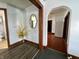 Hallway featuring stylish trim, decorative accents, and access to other rooms within the home at 600 S Oak St, Fortville, IN 46040
