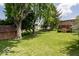 This expansive backyard boasts mature trees and a well-maintained lawn, offering a serene outdoor space at 6040 Manker St, Indianapolis, IN 46227