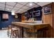 Finished basement with bar, wine storage, and stools at 6040 Manker St, Indianapolis, IN 46227