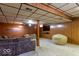 Basement Gathering room with sofa, TV and beanbag at 6040 Manker St, Indianapolis, IN 46227