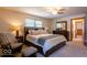 Cozy bedroom with a comfortable bed, chair, and dresser, offering a relaxing space at 6040 Manker St, Indianapolis, IN 46227