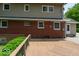 Large backyard deck boasts wood-style flooring and iron railing providing a relaxing outdoor living space at 6040 Manker St, Indianapolis, IN 46227