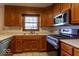 Traditional kitchen with stainless steel appliances and light countertops at 6040 Manker St, Indianapolis, IN 46227
