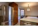 Kitchen area with stainless steel fridge and view to a dining area at 6040 Manker St, Indianapolis, IN 46227