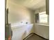 Bright laundry room featuring a water heater, washer hookups, and a window for natural light at 6150 E 25Th St, Indianapolis, IN 46219