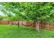 Relaxing backyard setting with a comfortable hammock hung beneath a mature shade tree at 6609 Fountain Springs Blvd, Indianapolis, IN 46236