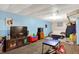 Finished basement with a TV, seating and play area, providing additional entertainment and living space at 6609 Fountain Springs Blvd, Indianapolis, IN 46236
