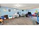 Spacious basement with playroom and carpet, offering ample space for activities and relaxation at 6609 Fountain Springs Blvd, Indianapolis, IN 46236
