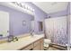 Well-lit bathroom featuring a neutral color scheme, a vanity with a sink, and a shower-tub combination at 6609 Fountain Springs Blvd, Indianapolis, IN 46236