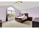 Bedroom with large window, vaulted ceiling, and carpet at 6609 Fountain Springs Blvd, Indianapolis, IN 46236