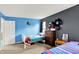Cozy bedroom featuring twin beds, blue walls, and a collection of baseball caps adding personality at 6609 Fountain Springs Blvd, Indianapolis, IN 46236
