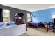 Bright bedroom with two twin beds, complemented by ample natural light and views of the outdoors at 6609 Fountain Springs Blvd, Indianapolis, IN 46236
