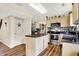 Bright kitchen featuring an island, stainless steel appliances, and modern backsplash at 6609 Fountain Springs Blvd, Indianapolis, IN 46236