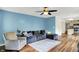 Comfortable living room with hardwood floors leading into kitchen at 6609 Fountain Springs Blvd, Indianapolis, IN 46236