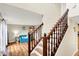 Open staircase leading to living space with hardwood floors at 6609 Fountain Springs Blvd, Indianapolis, IN 46236