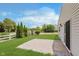 Backyard with well-maintained lawn, a paved patio, and a chain-link fence at 6703 Wimbledon Dr, Zionsville, IN 46077