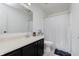 Bathroom with a vanity, toilet, and a shower with a patterned curtain at 6703 Wimbledon Dr, Zionsville, IN 46077