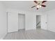 Well-lit bedroom includes closet, neutral walls, and a ceiling fan at 6703 Wimbledon Dr, Zionsville, IN 46077