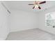 Spacious bedroom with ample closet space, ceiling fan, and a window at 6703 Wimbledon Dr, Zionsville, IN 46077