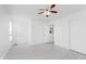 Bright bedroom features neutral walls, modern ceiling fan, and light vinyl flooring at 6703 Wimbledon Dr, Zionsville, IN 46077