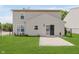Exterior view of the home features a well-maintained lawn and patio at 6703 Wimbledon Dr, Zionsville, IN 46077